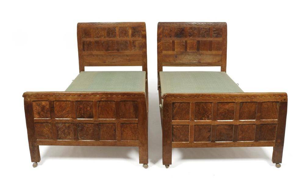 Lot 729 - A Pair of Robert  "Mouseman " Thompson Panelled Oak Single 3'6 " Bedsteads, circa 1930's, each with