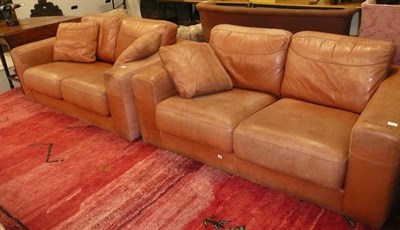 Lot 811 - Two brown leather  upholstered settees