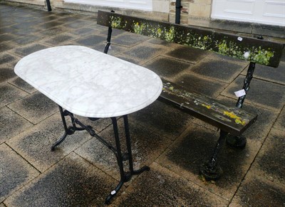 Lot 826 - Marble top garden table on wrought iron base and a bench (2)