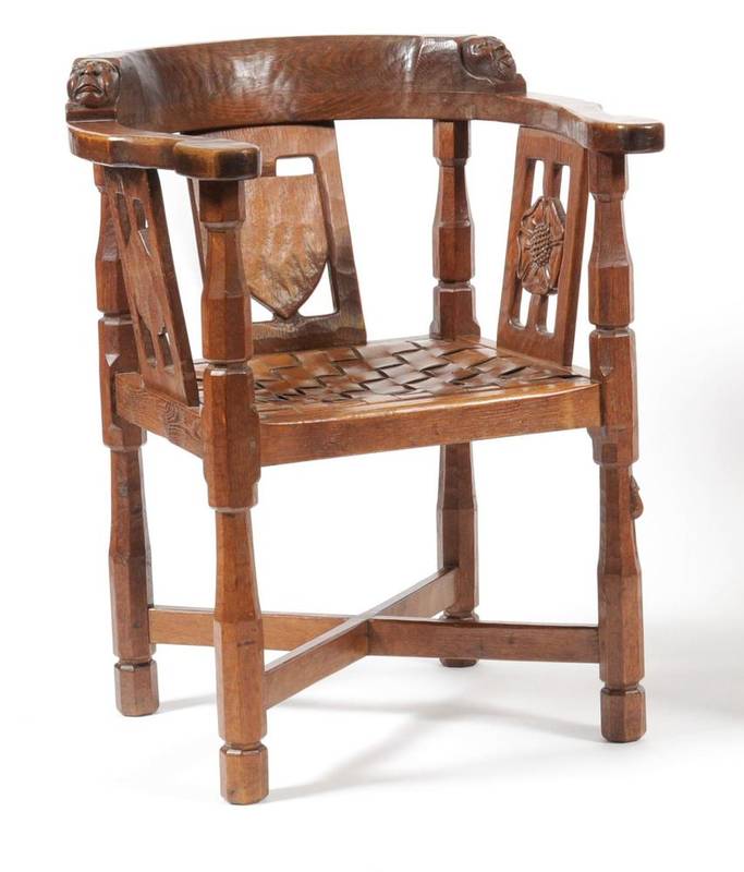 Lot 734 - A Robert  "Mouseman " Thompson English Oak Monk's Chair, circa 1930's, with curved back and...
