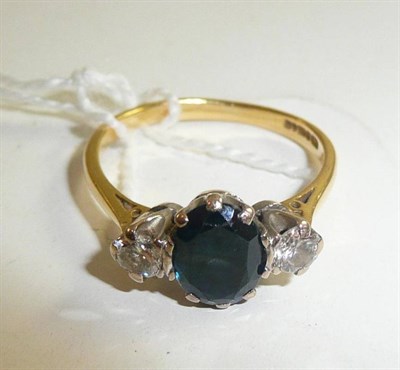 Lot 38 - An 18ct gold sapphire and diamond three stone ring