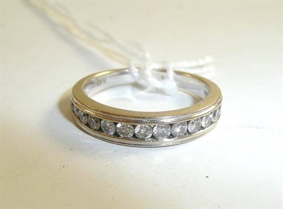 Lot 39 - An 18ct white gold diamond set half eternity ring