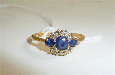 Lot 53 - A sapphire and diamond cluster ring