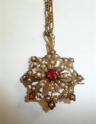 Lot 54 - A seed pearl set star brooch/pendant with composite central stone, on chain