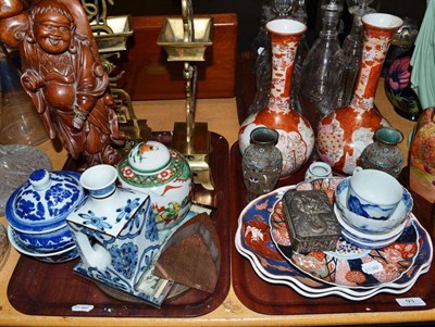 Lot 93 - Two trays of Oriental lamps, Chinese pots, carved lamp etc