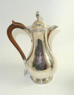 Lot 112 - A silver coffee pot with wooden handle, London 1783