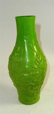 Lot 118 - A Chinese porcelain green monochrome glazed and carved vase