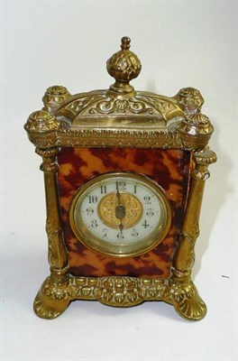 Lot 121 - Tortoiseshell veneered mantel clock with brass mounts