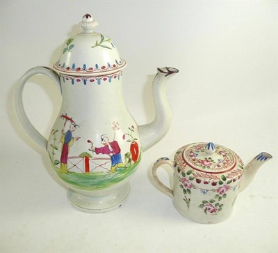 Lot 126 - An 18th century pearlware coffee pot with chinoiserie decoration and a similar floral decorated tea