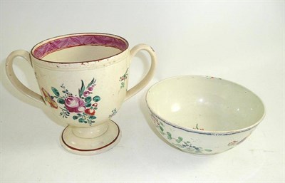 Lot 127 - An 18th century creamware loving cup and a pearlware bowl