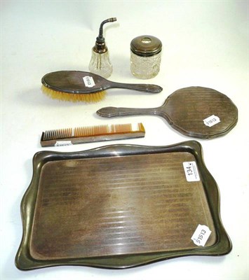 Lot 134 - Matched four piece silver dressing table set, comprising tray, mirror, brush and comb, a silver tot