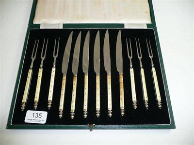 Lot 135 - A cased set of ivory-handled fruit knives and forks