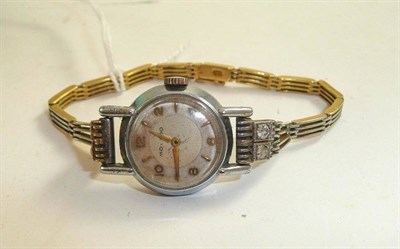 Lot 163 - A lady's diamond set platinum fronted 'Movado' wristwatch