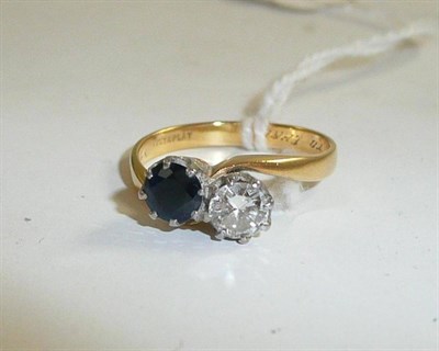 Lot 166 - A diamond and sapphire ring