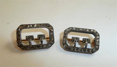 Lot 168 - A pair of miniature rose cut diamond set buckle brooches (a.f.)