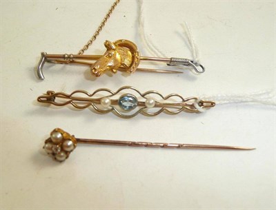 Lot 187 - An equestrian bar brooch, another bar brooch and a split pearl and diamond set pin