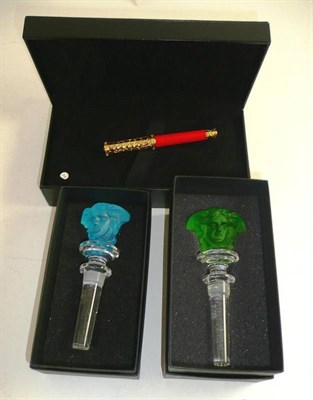 Lot 210 - Modern Versace cut glass bottle stopper in blue, another in green and a boxed and cased Versace...