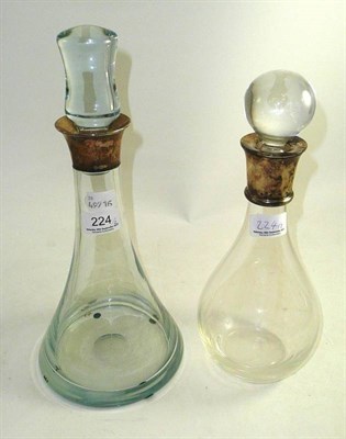 Lot 224 - Two plain glass decanters with silver neck mounts