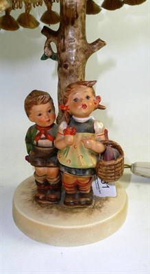 Lot 231 - Hummel table lamp of two children holding a basket, with original shade