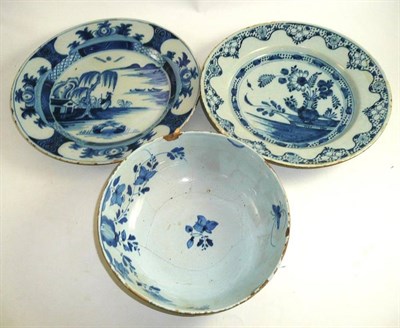 Lot 251 - An English Delft dish decorated with a Chinese landscape, another with flowers and a...