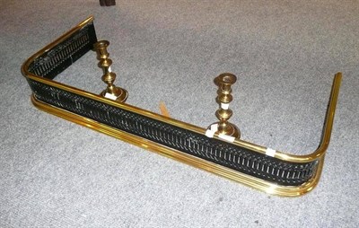 Lot 259 - Brass fire guard and a pair of brass candlesticks