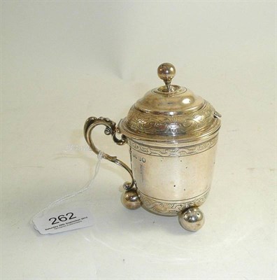 Lot 262 - A Victorian silver mustard pot on bun feet