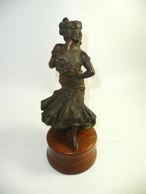 Lot 269 - A French bronze figure of a flamboyant lady in a hat, circa 1900, on later wooden socle base