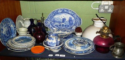 Lot 288 - Shelf of 19th century blue and white ceramics including two strainers, cream ware plates, cranberry