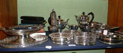 Lot 292 - A collection of silver plate including three pairs of wine coasters, a four piece tea service,...