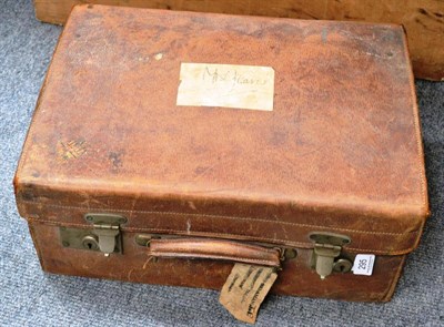 Lot 295 - A fitted leather case with silver topped jars and green leather accessories, a cased manicure...