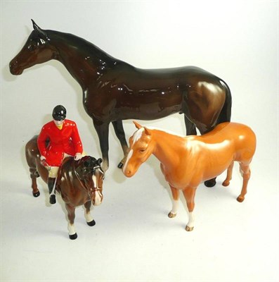 Lot 369 - Beswick Huntsman on brown horse (a.f.), large brown Racehorse and Palomino Imperial