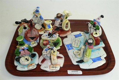 Lot 386 - A two piece clown band on signed plinth, and six individual band members with instruments on...