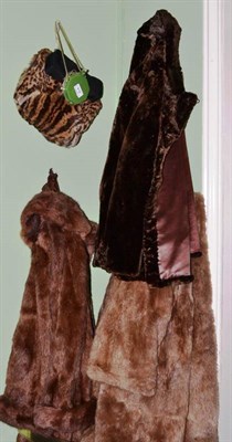 Lot 416 - Three fur coats, moleskin jacket, fur muff and two evening purses