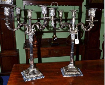 Lot 446 - A pair of silver plated four branch, five light candelabra