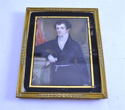 Lot 465 - An early 19th century portrait on ivory of a gentleman wearing a blue jacket, unsigned