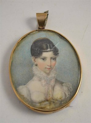 Lot 470 - A 19th century portrait miniature on ivory of a young girl in a yellow metal frame with...