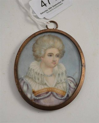 Lot 471 - An oval portrait miniature of a lady in costume, signed H Moss, in a gilt metal frame