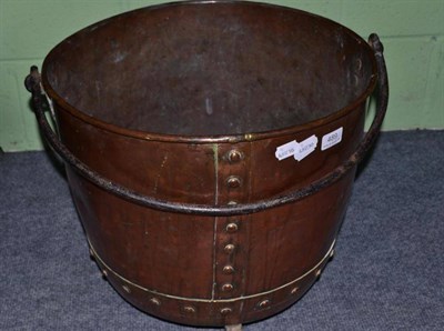 Lot 489 - A large Arts and Crafts copper and cast iron log bin