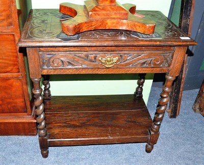 Lot 569 - Carved oak side table with drawer