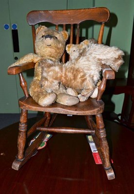 Lot 579 - Two English plush Teddy Bears, an Alpha toys plush dog, a stool and a rocking chair