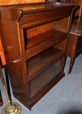 Lot 586 - A Globe Wernicke style oak three section bookcase