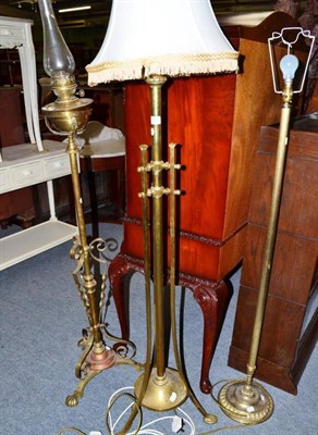 Lot 587 - An Art Nouveau brass floor standing oil lamp and two others