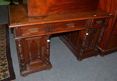 Lot 601 - A 19th century oak desk with columns to the doors