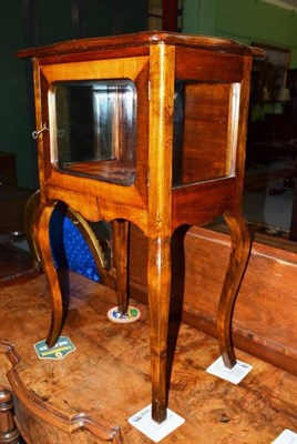 Lot 605 - A small French side cupboard with glazed panels