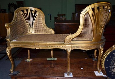 Lot 611 - French gilt and cane seated conversation settee