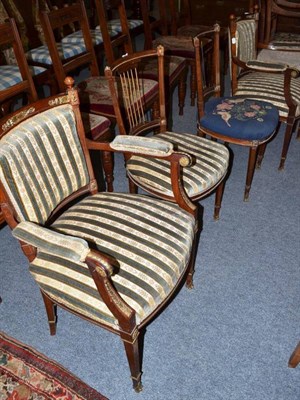 Lot 631 - Two Regency style mahogany armchairs with gilt metal mounts and two matching side chairs