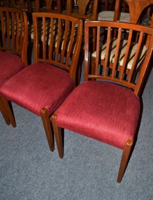 Lot 634 - Four red upholstered dining chairs