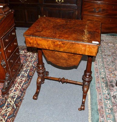 Lot 654 - A Victorian burr walnut sewing table