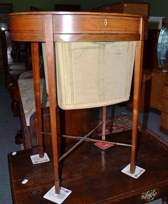 Lot 674 - An Edwardian painted satinwood oval sewing table