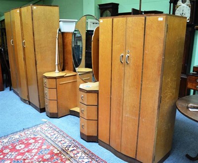 Lot 676 - An Art Deco bird's eye maple bedroom suite, comprising dressing table, wardrobe, hat robe, bedstead